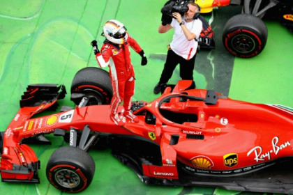 Vettel claims 50th win and goes top in title race.jpg