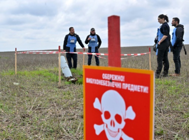 Ukraine farmer risks life clearing shells from fields.jpg