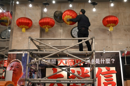 Its lobby was adorned with calligraphy, a gong and drum for good luck -- as well as 108 round lamps suspended from the ceiling