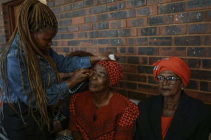 At the makeup corner, the top request was deep red and berry toned lipsticks - Phill Magakoe (AFP)