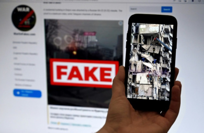 The nearly four-year conflict has become an information war - OLIVIER DOULIERY (AFP)