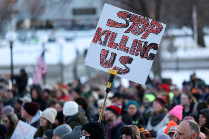 Neighbors are banding together to protect one another from US Immigration and Customs Enforcement raids in the wake of a fatal shooting by a federal agent - CHARLY TRIBALLEAU (AFP)