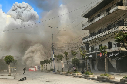 The latest war between Israel and Hezbollah entered a second week on Monday - STR (AFP)